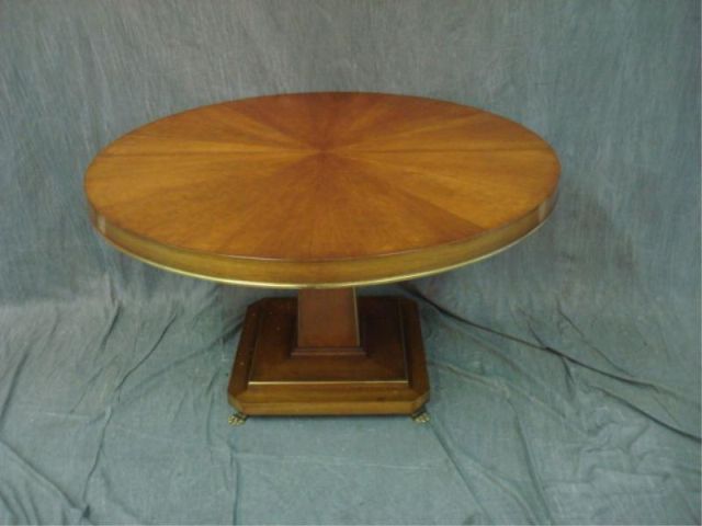 Appraisal: Center pedestal dining table with brass trim Has leaves and