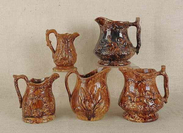 Appraisal: Five Rockingham glaze pitchers th c tallest -