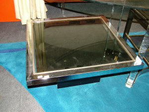 Appraisal: A chromed metal smoked glass coffee table circa the steel