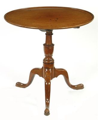 Appraisal: A mahogany tripod table the circular dished edge tilt top