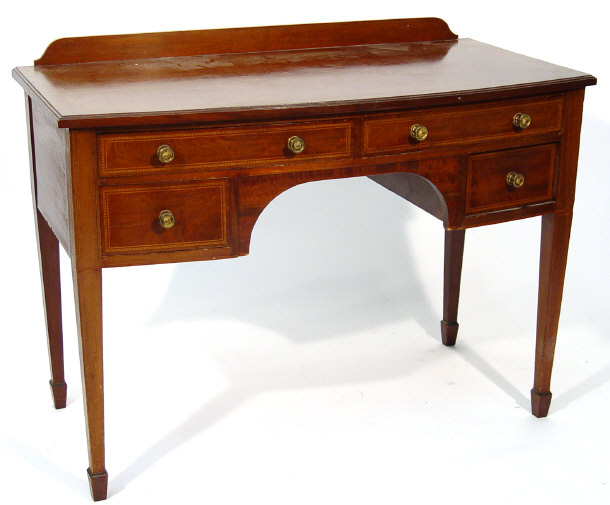 Appraisal: Edwardian inlaid mahogany kneehole dressing table the bow front fitted