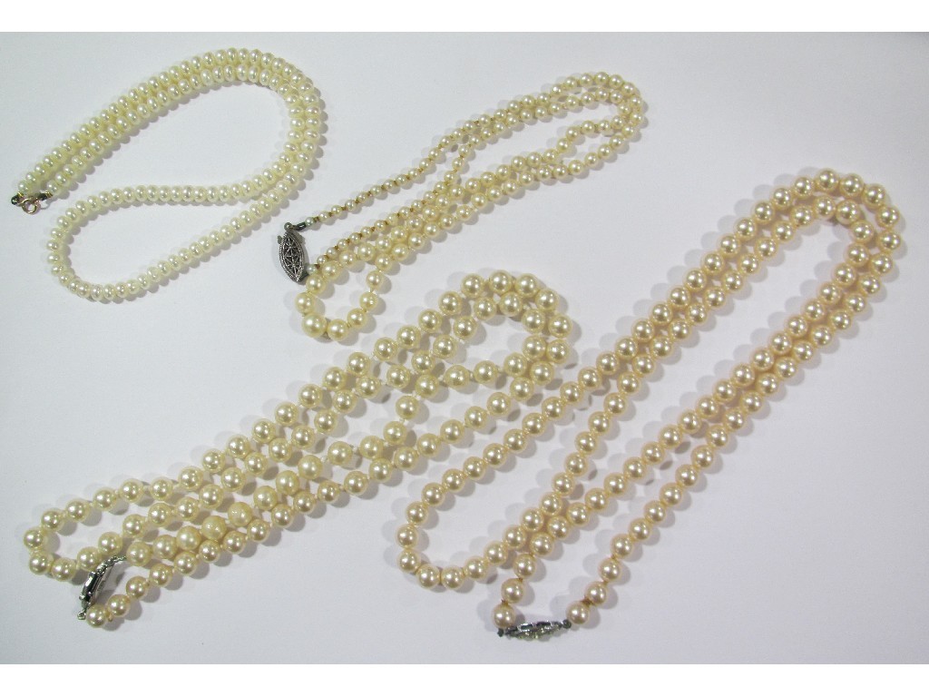 Appraisal: Two strings of cultured pearls and a quantity of paste