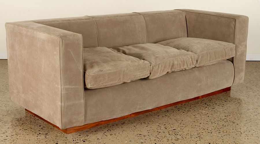 Appraisal: AN UPHOLSTERED EVEN ARM SOFA CIRCA An upholstered even arm