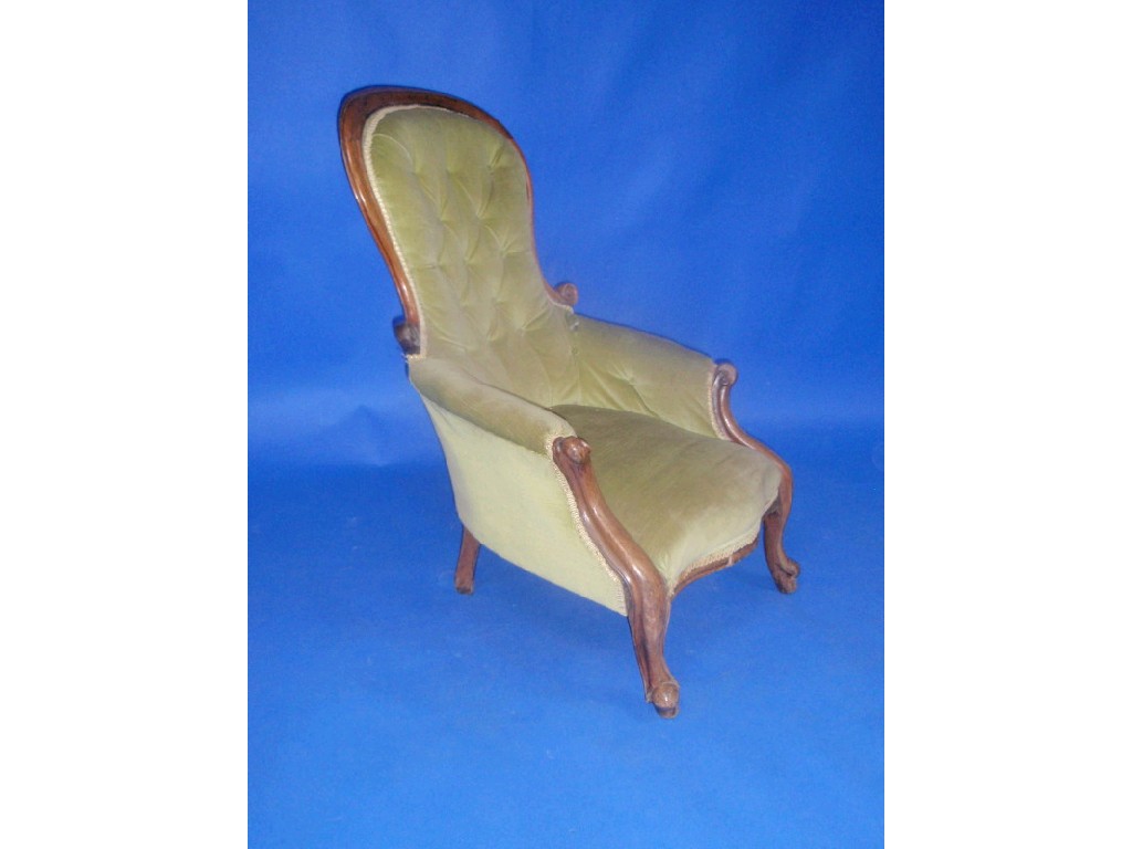 Appraisal: A Victorian mahogany spoon back armchair