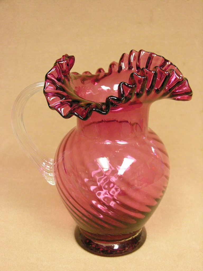 Appraisal: CRANBERRY SWIRL PITCHER This cranberry swirl pitcher has a ground