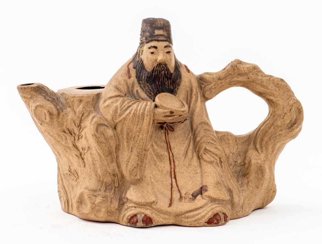 Appraisal: CHINESE CERAMIC TEAPOT IN FORM OF MAN TRUNK Chinese ceramic