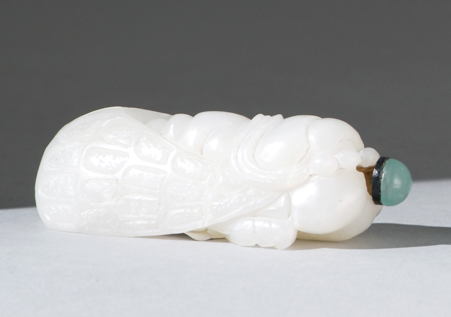 Appraisal: WHITE JADE SNUFF BOTTLE Late th CenturyIn the form of