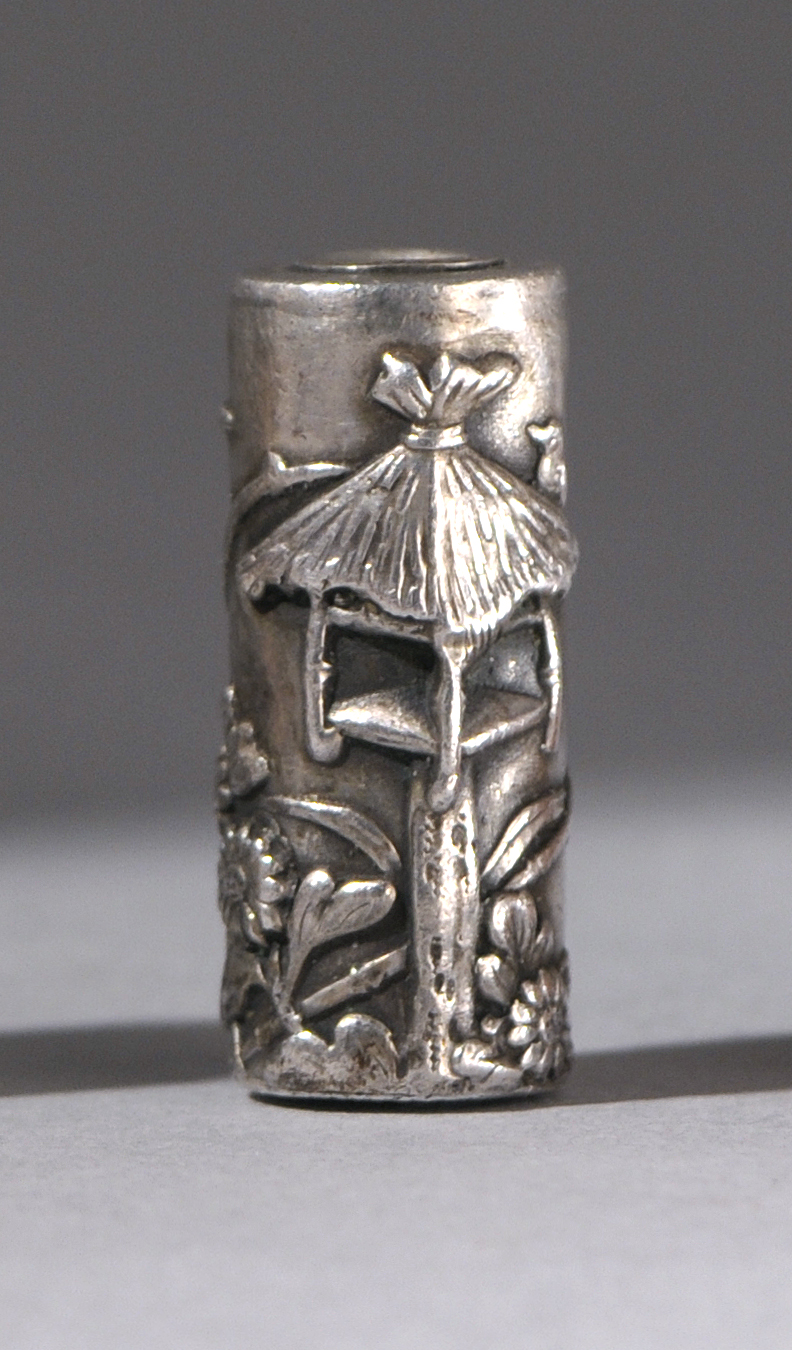 Appraisal: SILVER OJIME Early th CenturyIn cylinder form with raised decoration