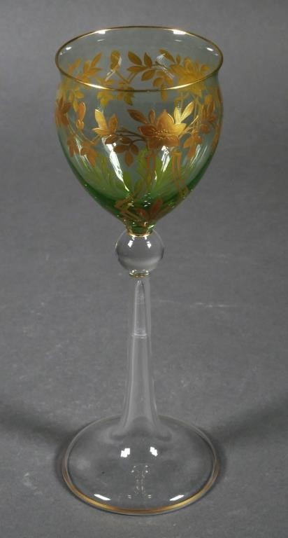 Appraisal: Green blown art glass wine stem with gilt decorations Unsigned