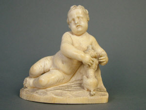 Appraisal: European carved ivory figure of a reclining putto with a