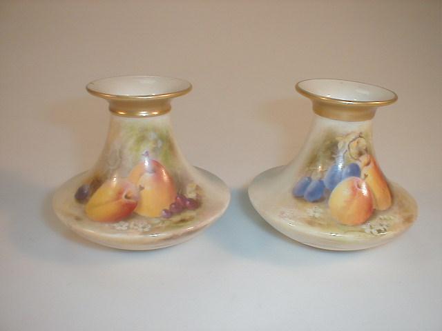 Appraisal: A pair of Royal Worcester vases painted with fruits against