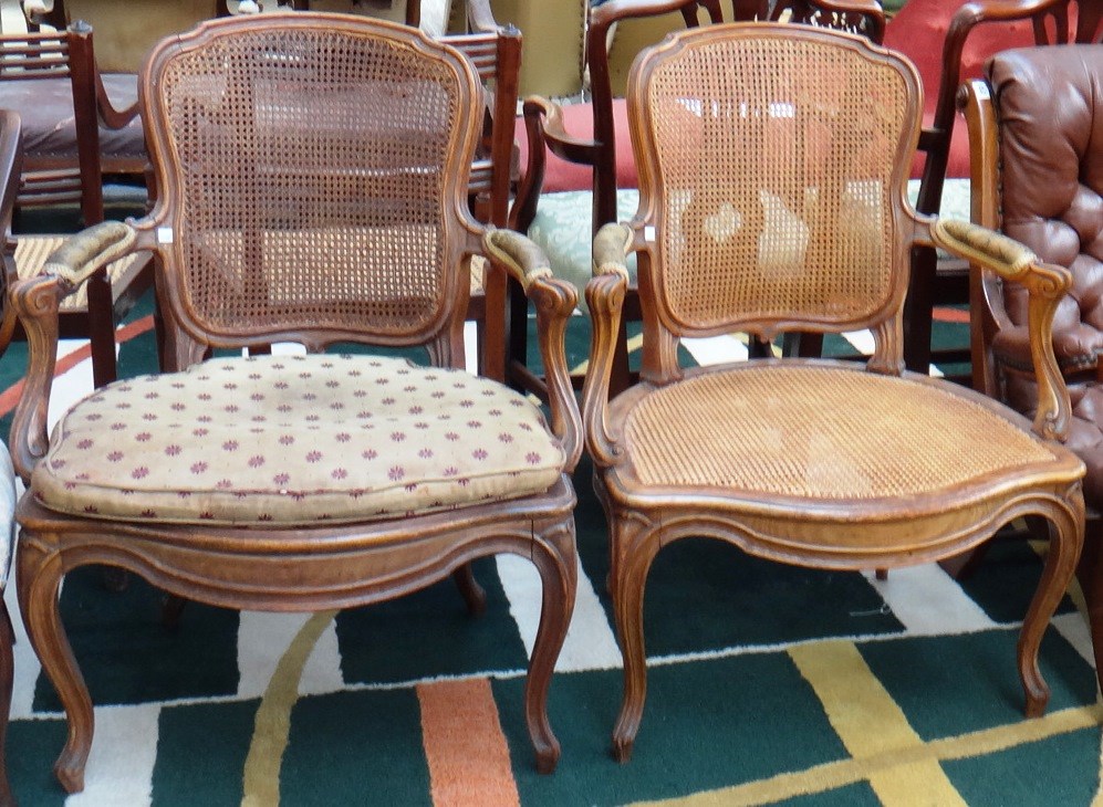 Appraisal: A pair of th century French stained beech fauteuils with