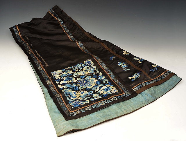 Appraisal: A CHINESE BLACK GROUND SILK AND EMBROIDERED SKIRT