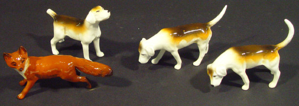 Appraisal: Three Beswick hunting hounds and a fox each with hand