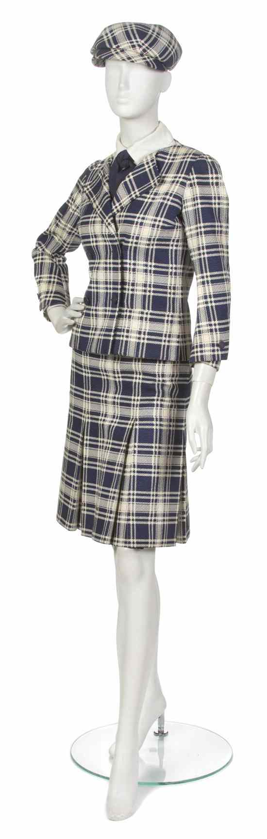 Appraisal: A Chanel Couture Navy and Cream Plaid Skirt Suit consisting