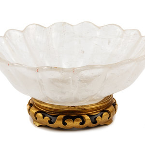 Appraisal: A Carved Rock Crystal Center Bowl on a Giltwood Base