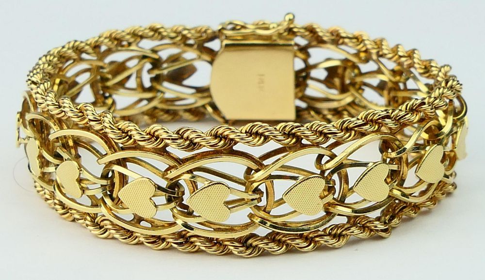 Appraisal: HEAVY LARGE KT Y GOLD BRACELET WITH HEARTS About long