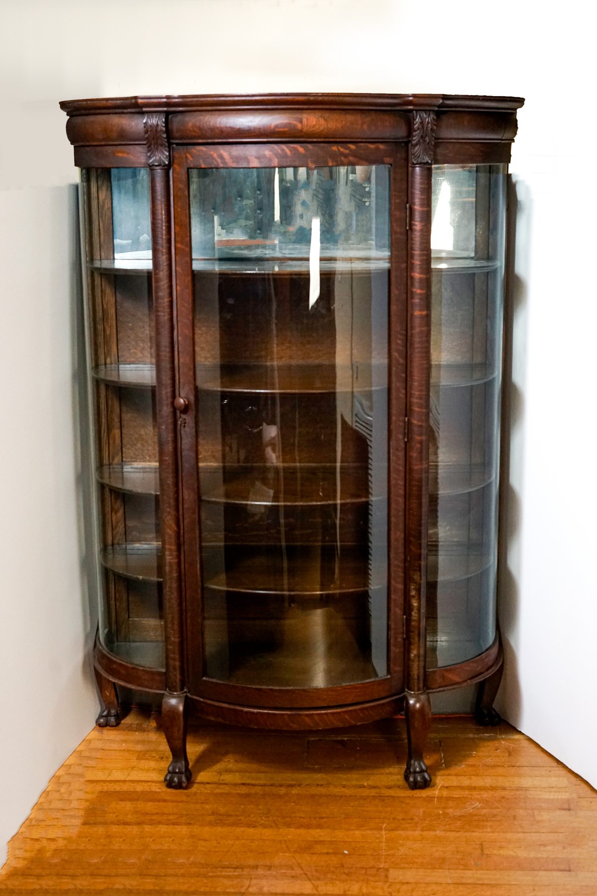 Appraisal: TRIPLE BOW OAK CURIO CABINET Single light Oak triple bow