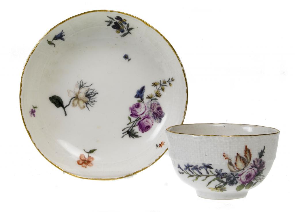 Appraisal: A MEISSEN TEA BOWL AND SAUCER with osier moulded border