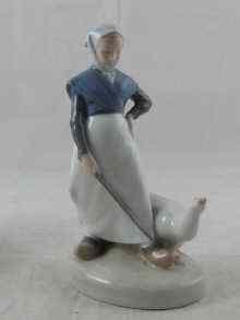 Appraisal: A Royal Copenhagen ceramic model of a goose girl cm