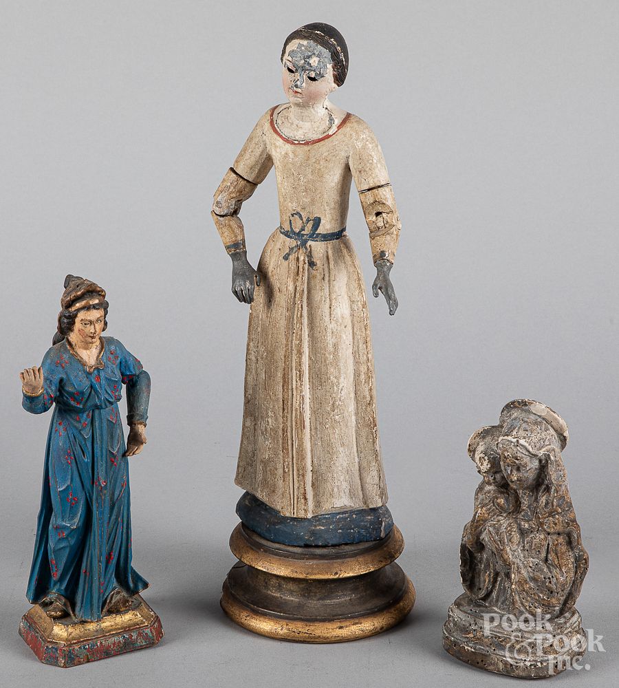 Appraisal: Two carved and painted Santos figures th c Two carved