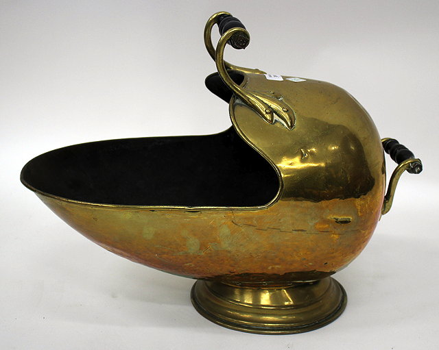 Appraisal: A VICTORIAN BRASS COAL SCUTTLE with turned ebony handles cm