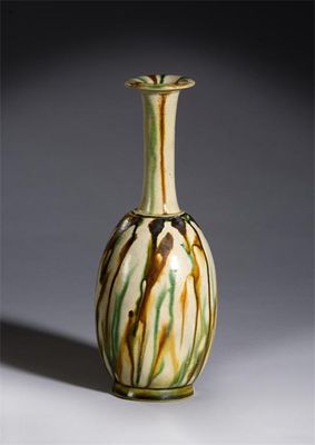 Appraisal: A Chinese pottery sancai-glazed slender mallet-shaped bottle vase Tang dynasty