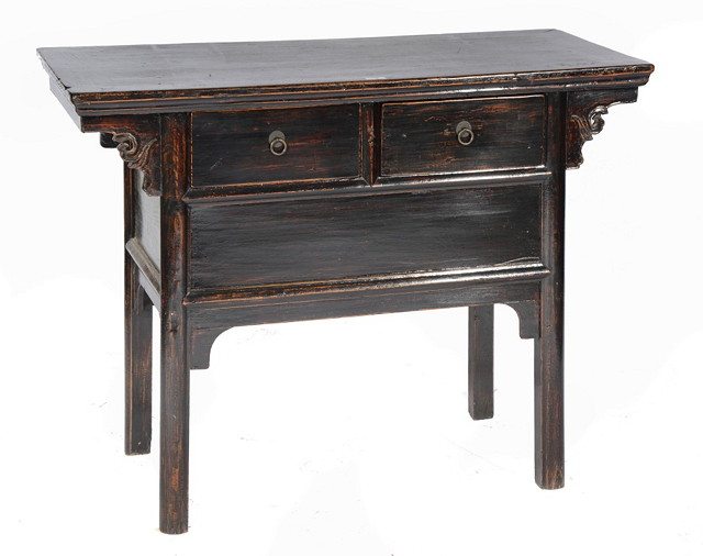 Appraisal: A CHINESE HARDWOOD SIDE TABLE fitted with two frieze drawers