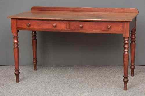 Appraisal: A Victorian mahogany washstand fitted two frieze drawers on turned