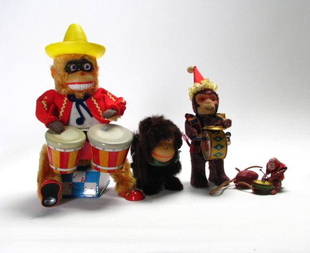 Appraisal: Group of three Japanese mechanical monkey toys including 'Bongo Monkey'