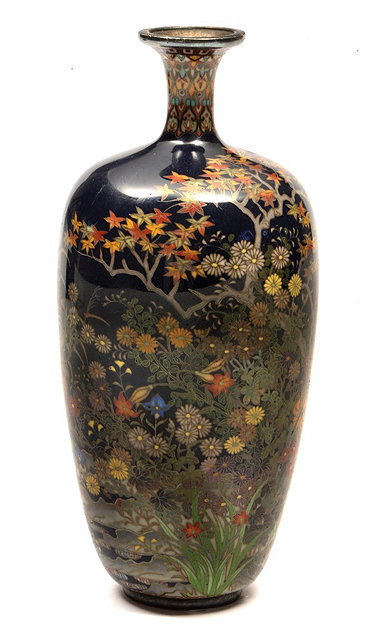 Appraisal: A JAPANESE MINIATURE CLOISONNE AND SILVER OVIFORM VASE decorated with