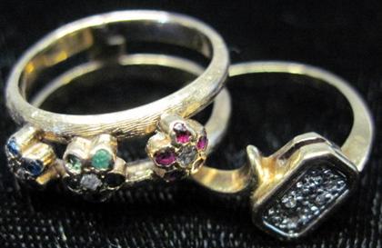 Appraisal: Two yellow gold ringsOne karat set with diamonds rubies sapphires