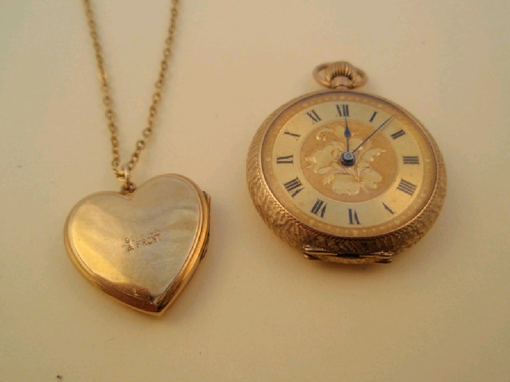 Appraisal: A heart shaped locket and chain stamped ct together with