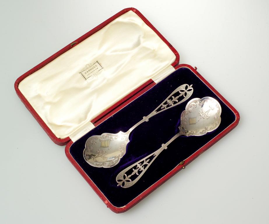 Appraisal: PAIR OF GEORGE V SILVER SERVING SPOONS SHEFFIELD with scroll