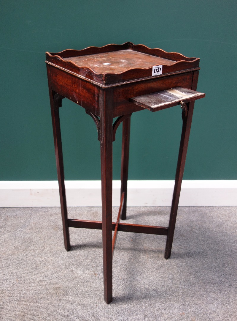 Appraisal: A George III mahogany kettle stand with galleried square top