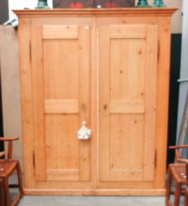 Appraisal: A large French amoire pine of two sections each section