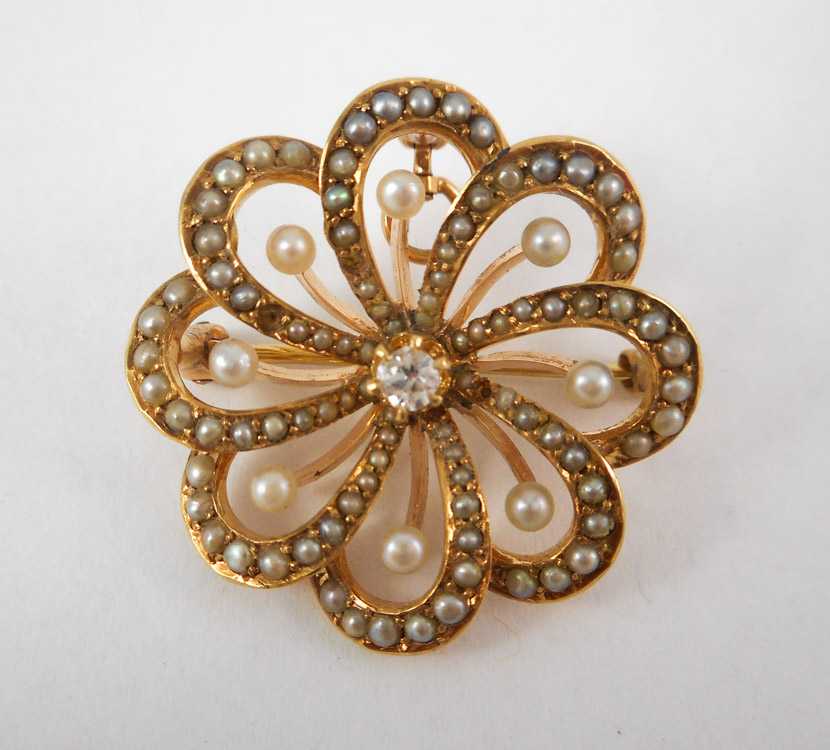 Appraisal: DIAMOND AND FOURTEEN KARAT GOLD PENDANT BROOCH with seed pearls