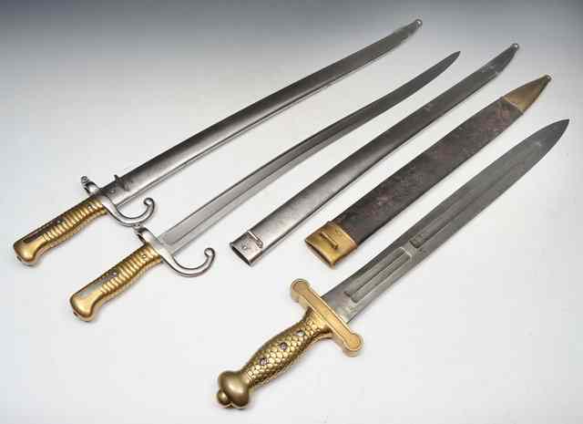 Appraisal: A FRENCH SHORT SWORD with steel blade leather scabbard and