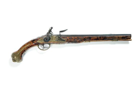 Appraisal: FLINTLOCK PISTOL European mid th century Relief carved stock of