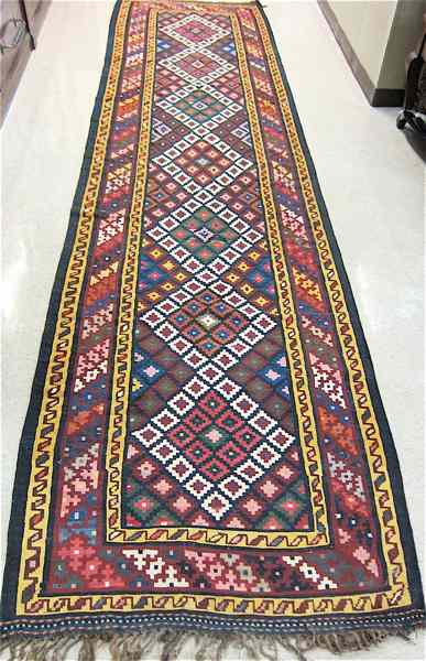 Appraisal: PERSIAN KILIM FLATWEAVE HALL RUG hand woven in a colorful