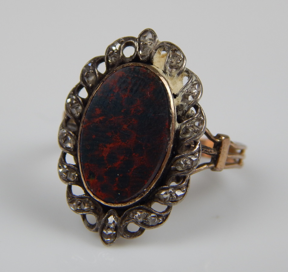 Appraisal: A Victorian dress ring with marquise bordering and red and