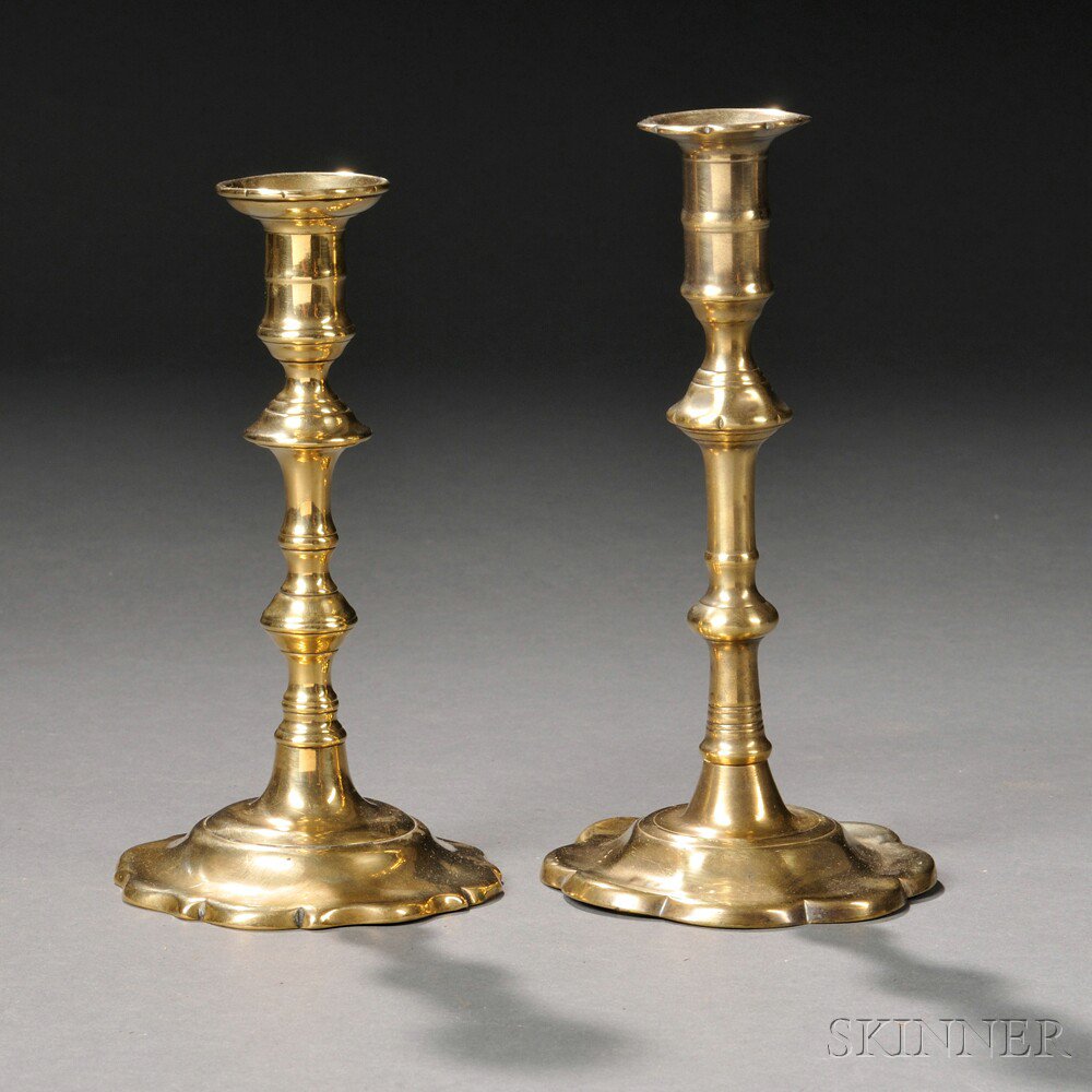 Appraisal: Two Brass Petal-base Push-up Candlesticks England early th century one