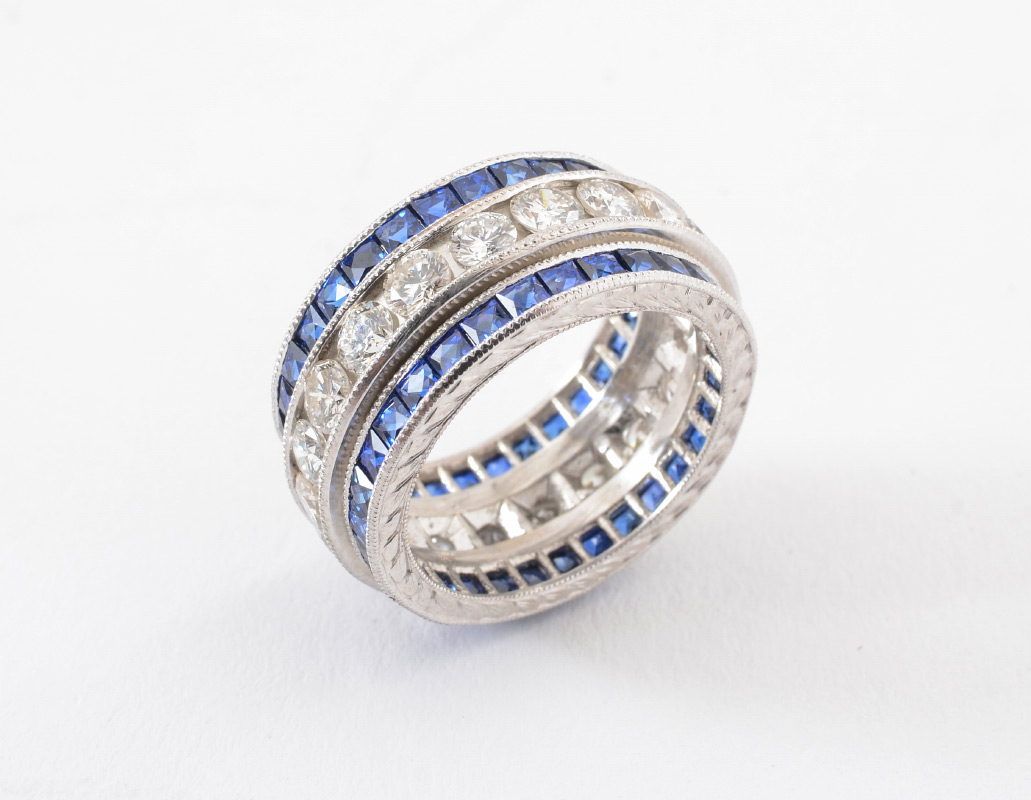 Appraisal: PLATINUM DIAMOND AND SAPPHIRE BAND RING A continuous band of