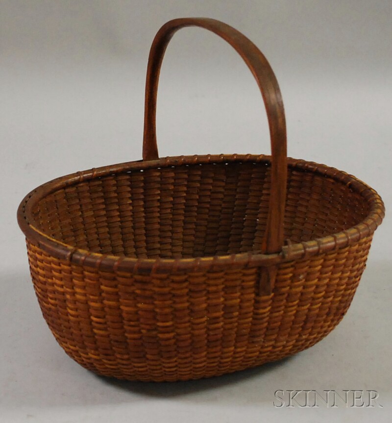 Appraisal: Oval Nantucket Basket early th century with carved upright handle