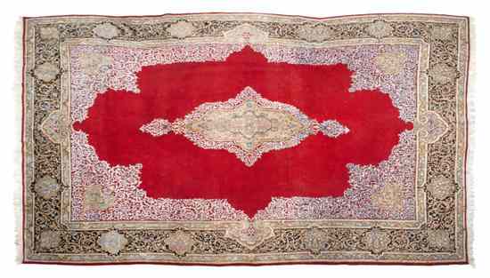 Appraisal: A Kirman Wool Rug the red gold and blue medallion