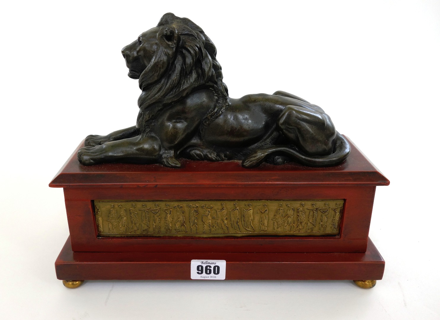 Appraisal: A pair of modern bronze lions raised on wooden plinths