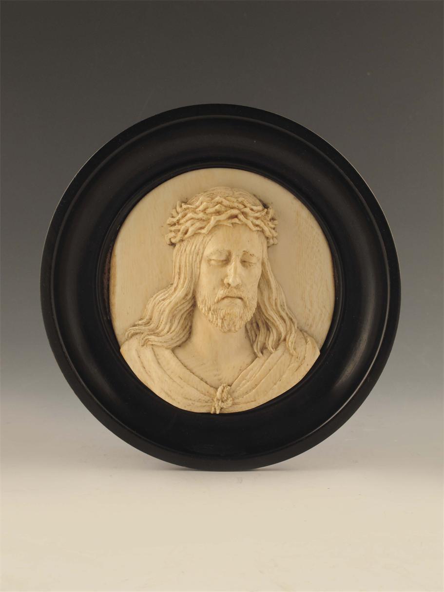 Appraisal: A th century continental relief carved ivory bust of Christ