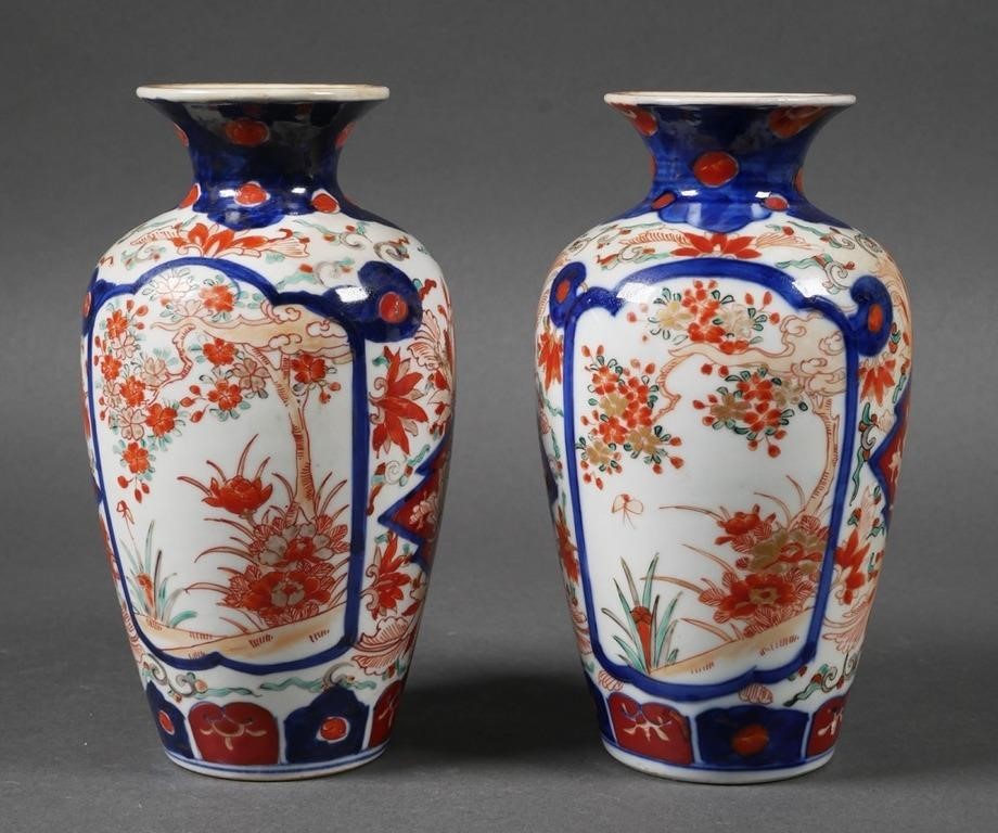 Appraisal: Two Japanese Imari vases with hand painted floral landscape motifs