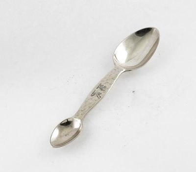 Appraisal: A Victorian double-ended medicine spoon with a 'hammered' centre section