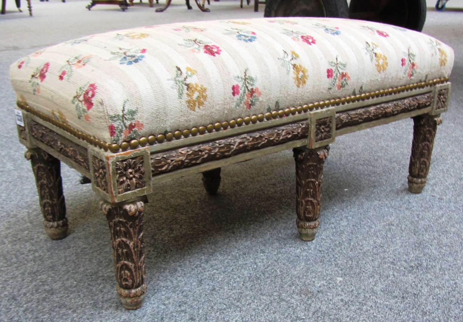 Appraisal: A th century Italian carved and painted rectangular footstool on